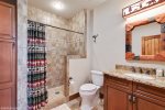 There is one full bathroom with a stunning tile shower